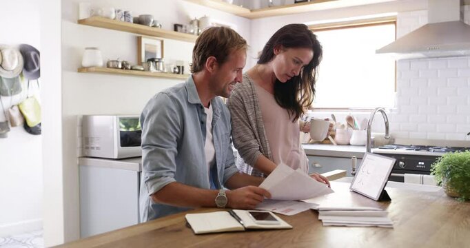 Young couple, bills and documents on technology for home budget, financial taxes or mortgage application in kitchen. Happy woman and man with paperwork, digital tablet and talk of loan or bank letter