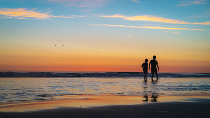 Children Exploring Beach at Sunset © Wesley