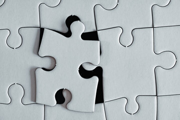 The last piece of a puzzle that is near its final position