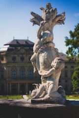 Obraz premium Cherub Statue Outside a Stately Manor House