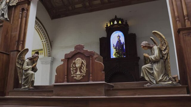 Church interior in Sri Lanka with statues and sculptures
