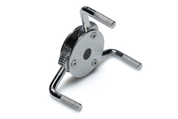 Studio photography of a three legged adjustable oil filter wrench isolated on a white background. Side view, close-up shot of automobile spare parts for passenger cars and light trucks.