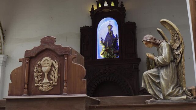 Church interior in Sri Lanka with statues and sculptures
