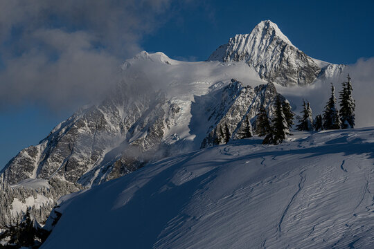 USA, Washington State. Wind blown sastrugi and Mount Shuksan near Mount Baker Ski resort.