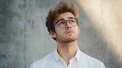 Fototapeta premium Contemplative Young Man in a Shirt