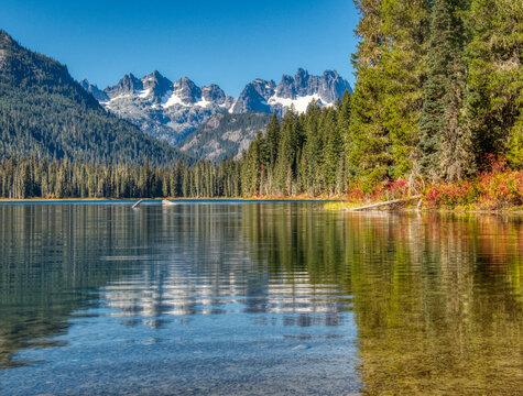 USA, Washington State. Cooper Lake in Central Washington, Cascade Mountains reflecting in calm waters.