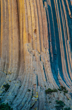 USA, Wyoming, Devil's Tower National Monument detail of columnar basalt formations at sunset
