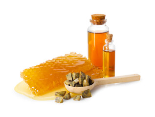 Natural honey tincture, propolis granules and sweet honeycombs isolated on white