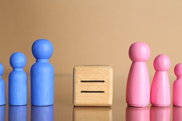 Gender equality concept. Male and female figures on beige background