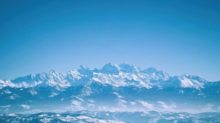 Obraz premium majestic mountain range under a clear blue sky