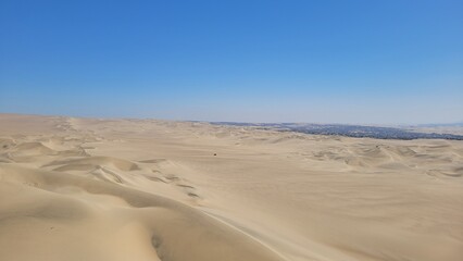 Sand dunes desert city Peru