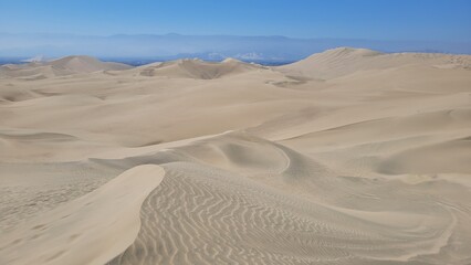 Sand dunes desert city Peru