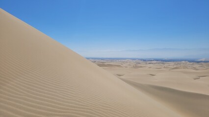Sand dunes desert city Peru