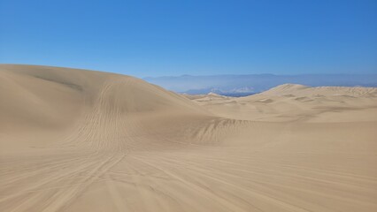 Sand dunes desert city Peru