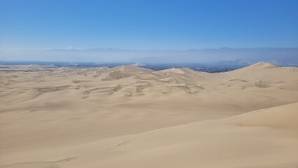 Sand dunes desert city Peru