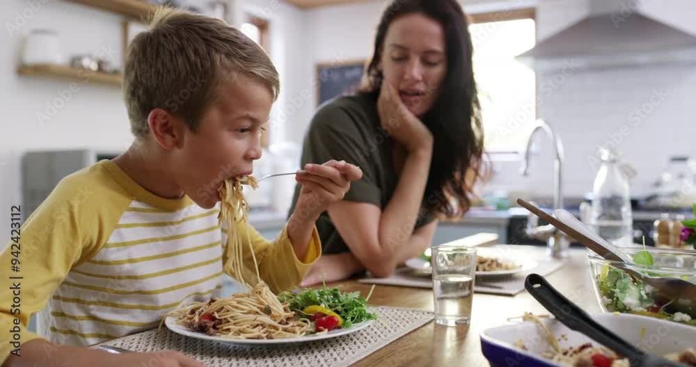 Poster Food, happy and funny with family in kitchen for health, love and eating together. Smile, lunch and nutrition with parents and children at dining table in home for dinner, wellness and bonding