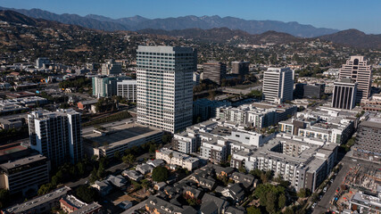 Fototapeta premium Glendale, California, USA - August 18, 2024: Afternoon sunlight shines on the downtown urban core of Glendale.