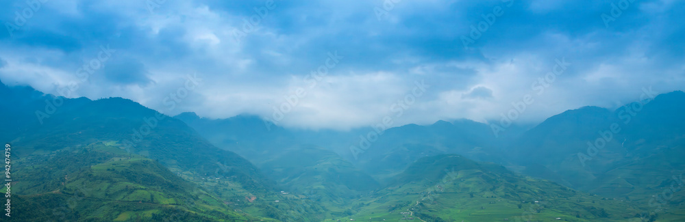 Wall mural banner beautiful mountain landscape foggy mountain green landscape morning sunrise. amazing landscap