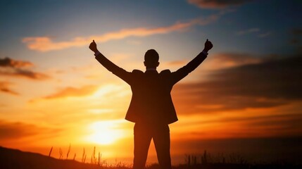 Fototapeta premium Silhouetted figure celebrating at sunset, capturing the essence of achievement and freedom in a vibrant, serene landscape.