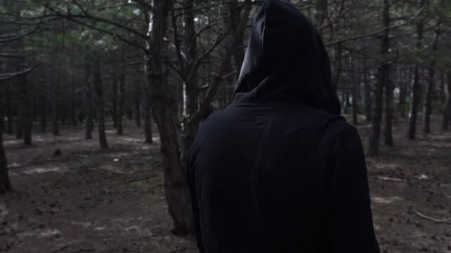 Man  with black hoodies  walks into the forest on Ankara Forrest Track