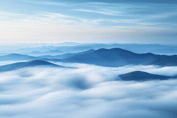 Fototapeta premium A serene, high-altitude landscape where a range of mountains appear to float above a dense sea of clouds, with the scene bathed in the cool, blue light of early morning. 