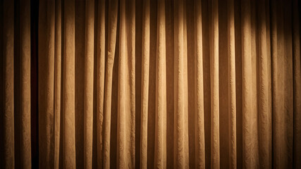 Obraz premium Soft, warm light illuminating a curtain, vintage theater look, rich textures, nostalgic and cozy atmosphere