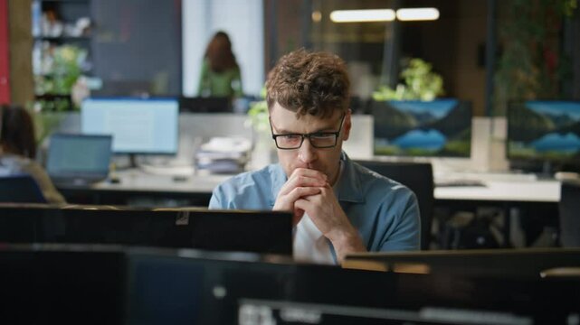 Overworked manager staring desktop working open space closeup. Tired freelancer