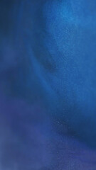 Blue background. Sparkling texture. Defocused navy color shiny ink water glowing twinkle particles dark abstract bokeh art.