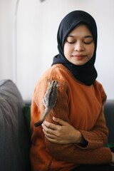 Sugar Glider Or Petaurus Breviceps Climbing On a Woman Shoulder.