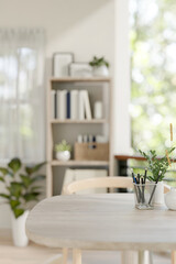 A space for displaying products on a wooden table in a contemporary bright room at home.