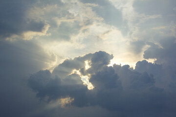 This is a landscape with sunlight shining through the clouds.