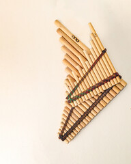 Panpipes on beige background isolated. Rondador. Andean Instruments. South American instruments. Wind instruments. Pan flute.