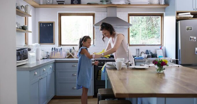 Mom, girl and gloves for cleaning kitchen, helping hand and teaching for hygiene, dirt or germs in family home. Smile, mother and daughter for learning, development or bacteria for health in house