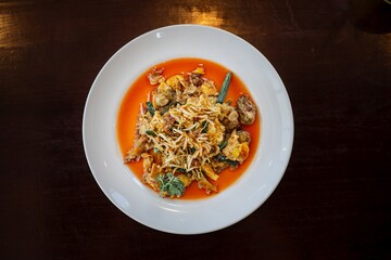 Flat lay shot of a plate of Hawker-style Oyster Omelette containing stir-fried oyster and fried...