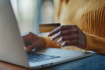 Woman Making Online Purchase with Credit Card on Laptop at Home
