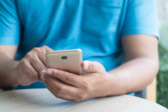 Hand using smartphone, hand of old asian senior man starts using smartphone, urgan digital lifestyle adaptation for old people concept