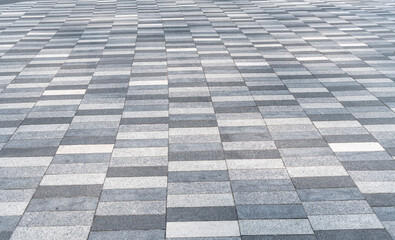 Stone tile pavement. Paving slabs or stone. Tiled sidewalk. Sidewalk made of paving slabs. Stine slabs background. Sidewalk paving background. Tiled backdrop. Background of tiled paving