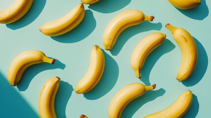 Vibrant bananas scattered on a soft blue background. These fresh and colorful fruits create a fun and lively visual effect. Perfect for food presentations or healthy lifestyle themes. AI