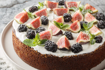 Dark mood cake with Figs, Blackberry and Ricotta Cake closeup on the plate on the table. Horizontal