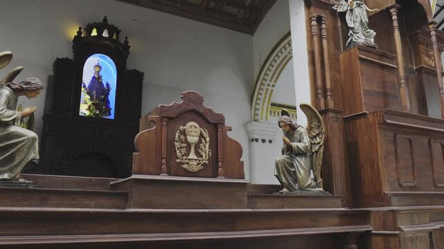 Church interior in Sri Lanka with statues and sculptures
