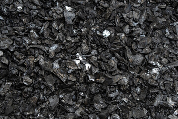 Fresh coal close up with white dust