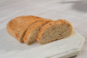White sliced ​​bread lies on a light background
