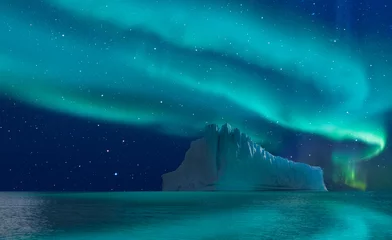 Iceberg floating in greenland fjord   with aurora borealis - Greenland