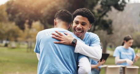 Men, volunteer and people hug in park together for solidarity, support or sustainability at green...