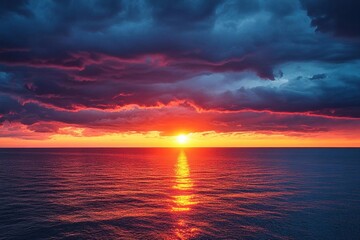 Fototapeta premium Sun setting behind a line of thunderstorms on the horizon, dramatic weather, contrast of light and dark