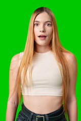 Young Woman With Surprised Expression in Front of Green Screen