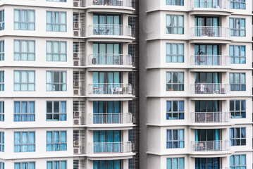 Obraz premium Close up view on the residential building, repeating objects - windows and balconies. Abstract pattern.