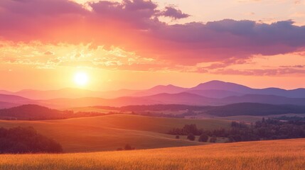 Obraz premium A stunning sunset over a rolling countryside with distant mountains, offering space for text. Perfect for rural, travel, or nature-themed designs.