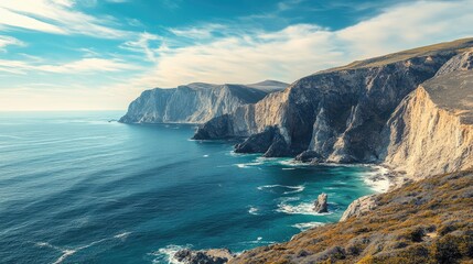Obraz premium A sweeping view of a rugged coastline with cliffs and ocean waves, offering wide space for text. Perfect for coastal, travel, or adventure promotions.