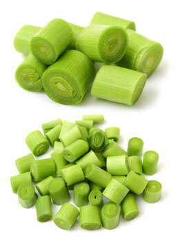 young green garlic leaves isolated on white background